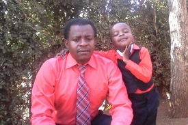 Pastor Sammy and son.JPG